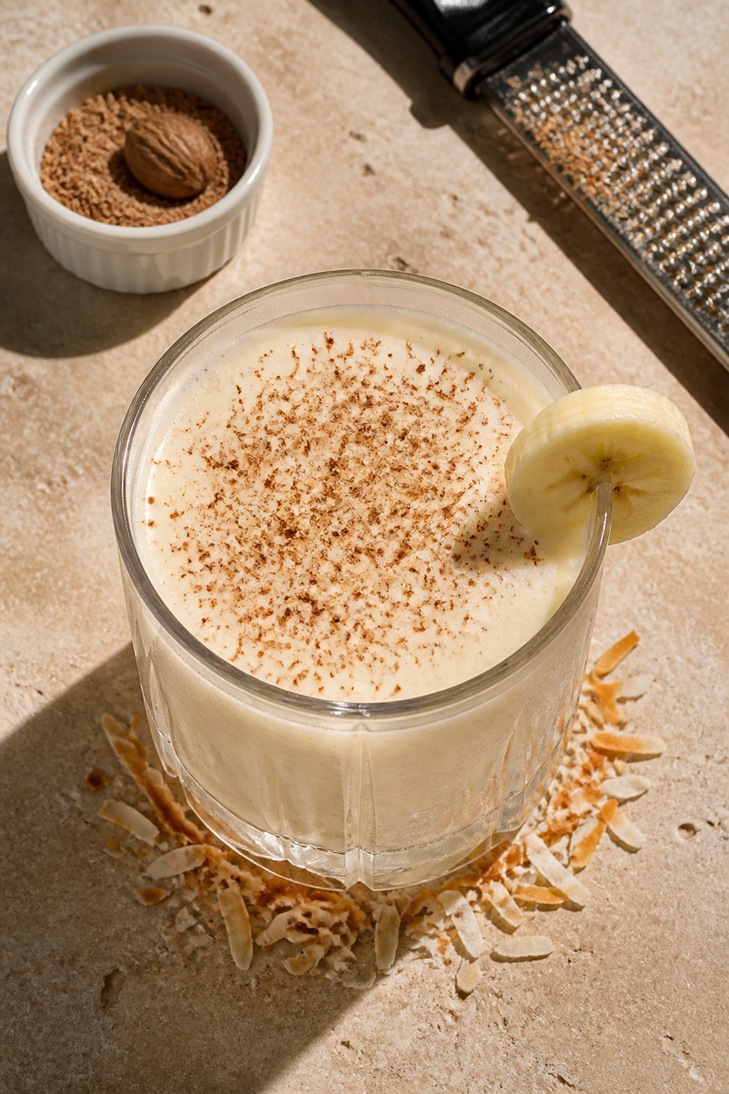 Final dish, top view: Overhead shot of the finished Banana Rum Cream Cocktail in a frosty rocks glas